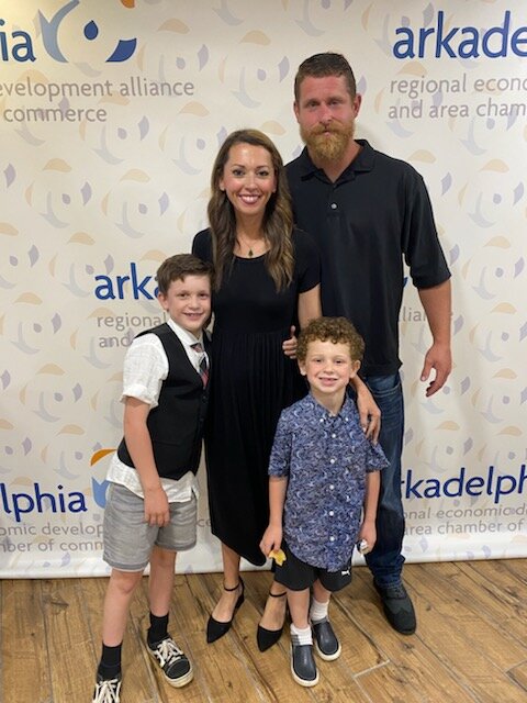 Chamber+of+Commerce+Executive+Vice+President+Nikki+Chandler+stands+with+her+husband+and+two+children+who+are+all+heavily+involved+in+the+city+of+Arkadelphia.