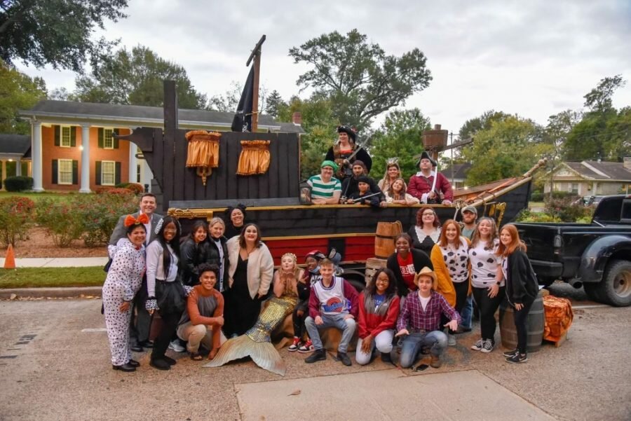 The Student of Activities Board of Henderson crowded around a pirate ship.