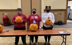 Students of Henderson pictured with their pumpkin carving.