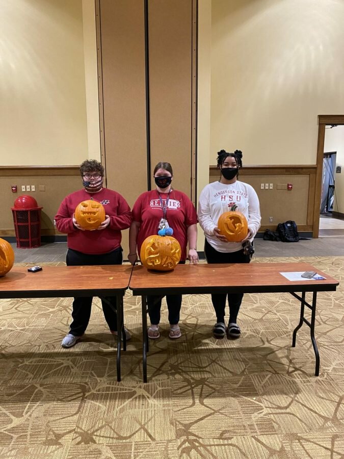 Students of Henderson pictured with their pumpkin carving.