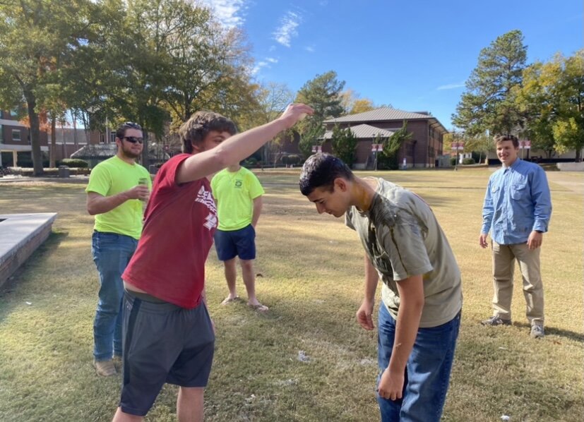 Henderson student egging phi sigma kappa member, Will Taylor, in the head.