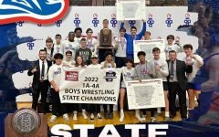 First picture from Dustin Grimmett- Wrestling coaches Dustin Grimmett (Left) and Andrew Steely(Right) pose with their state title trophy. Second Picture from Badger Athletics- The Arkadelphia wrestling team after winning the state title.